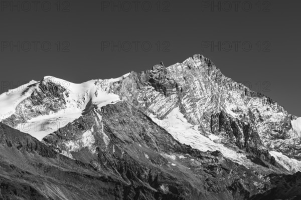 Snowy peak of Weisshorn mountain, black and white photo, Val d'Anniviers, Valais Alps, Canton of