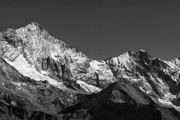 Snowy peaks of the Weisshorn and Schalihorn mountains, black and white photo, Val d'Anniviers,