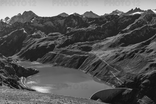 The Lac de Moiry reservoir with the dam, in the background the peaks of the Grand Cornier, Tete