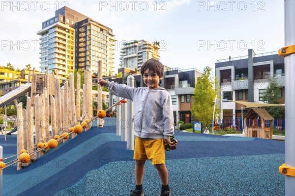 Cheerful child enjoys playing on a colorful and safe playground in vancouver, surrounded by modern
