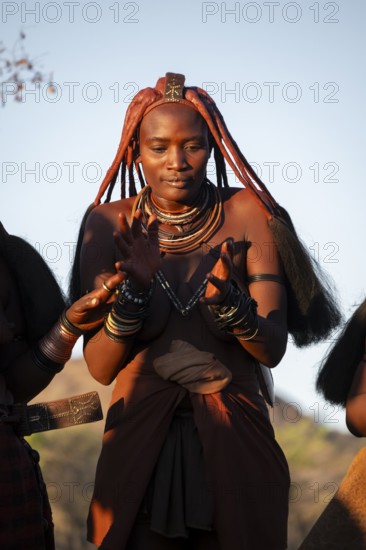 Portrait, Himba woman clapping, traditional clothing, Kaokoveld, Kunene, Namibia
