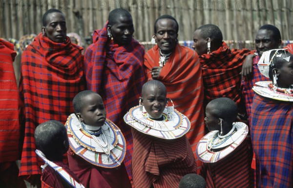 Maasai men and girls in their village in Ngorongoro Crater, Tanzania, Africa, June 2000, vintage,