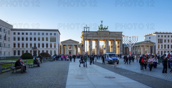 Tourists and police at the Brandenburg Gate at Christmas, daylight photo, Berlin, Germany