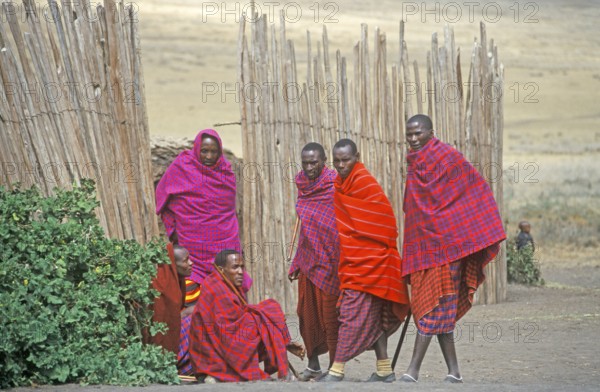 Maasai men in front of their village in Ngorongoro Crater, Tanzania, Africa, June 2000, vintage,