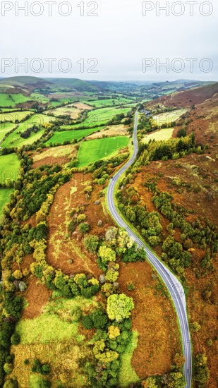 Autumn colours of Farms over River Wye and Road A470 from a drone, Llanidloes, Powys,