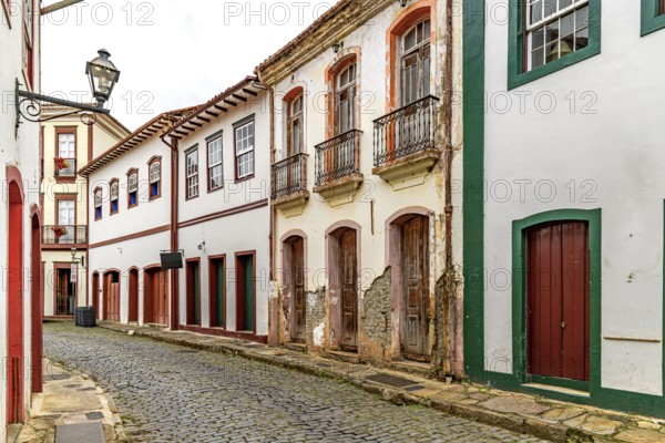 Strolling down the street among the colonial houses of the historic city of Ouro Preto, Ouro Preto,