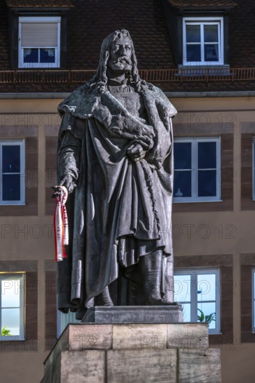 Illuminated statue of Albrecht Dürer in the evening, Albrecht-Dürer-Platz, Nuremberg, Middle
