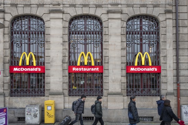 McDonald's logos on the historic lattice windows of the Old Post Office, Erlangen, Mittelfranklen,