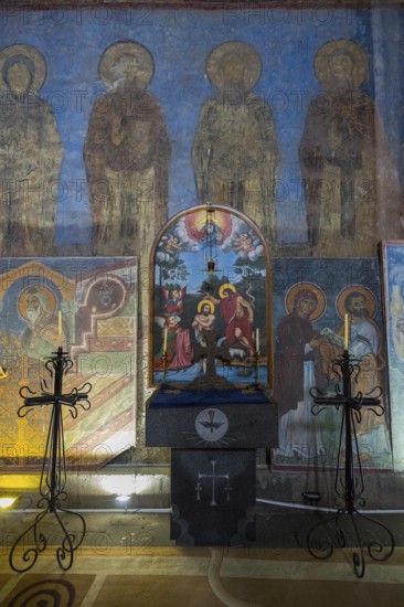 Interior of a church with icons and an altar surrounded by candlesticks, Akhtala monastery, Akhtala