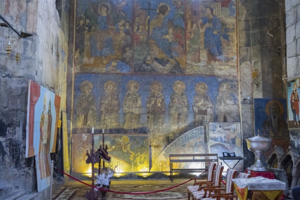 Church interior with rows of frescoes and abstract representations on the walls, Akhtala monastery,