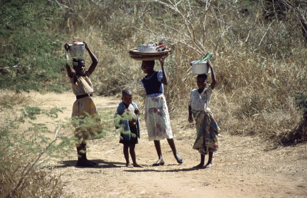 Girl with payloads, little boy, Malawi, Africa, June 2000, vintage, retro, old, historic