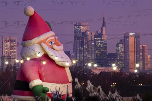 In a Christmas tree center near Frankfurt am Main, a multi-metre-high inflated figure of Santa