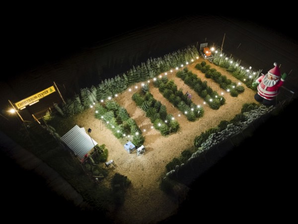 In a Christmas tree centre near Frankfurt am Main there is a decorative inflatable figure of Father