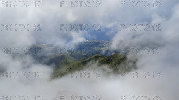 Fog clears, view of the valley from Pico Ruivo, hiking trail PR 1, 2, Madeira, Portugal