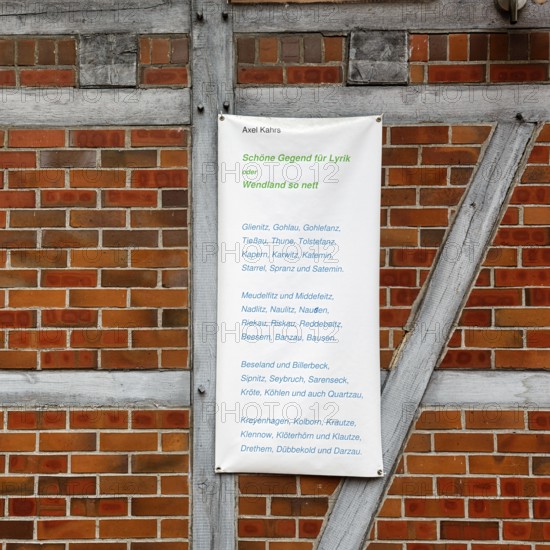 List of various villages in Wendland, poem, banner on a half-timbered wall, façade detail,