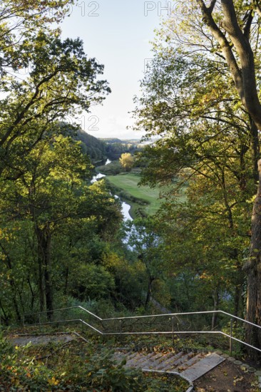 View from a viewpoint with stairs of picturesque river landscape, forest and meadows, Jeetzel,