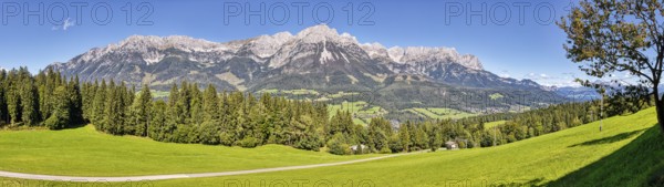 Wide green meadows against an impressive mountain backdrop, Austria, Ellmau, panorama