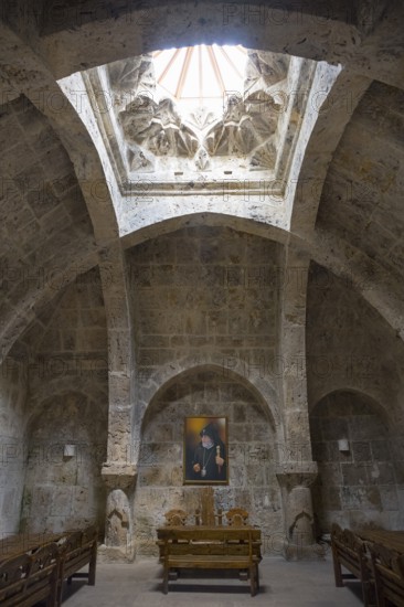 Church interior with skylight and painting, stone walls and vault, refectory interior, dining room,