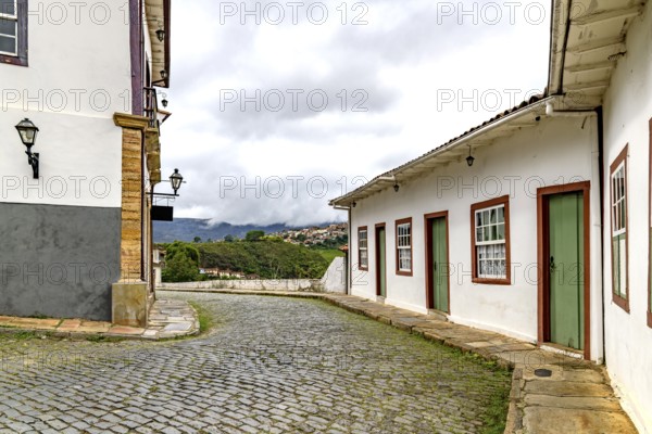 A winding street between historic houses in the city of Ouro Preto, Ouro Preto, Minas Gerais,
