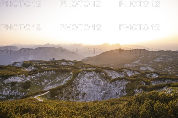 At the Berchtesgaden High Throne in summer at sunset, view of the Störhaus on Untersberg.