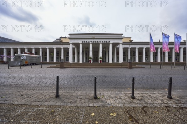 Hessian State Theatre, theatre crowds, brick street, barrier bollard, advertising flag on