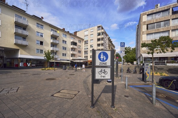 Pedestrian zone road sign, additional sign for cyclists free, general architecture, houses,