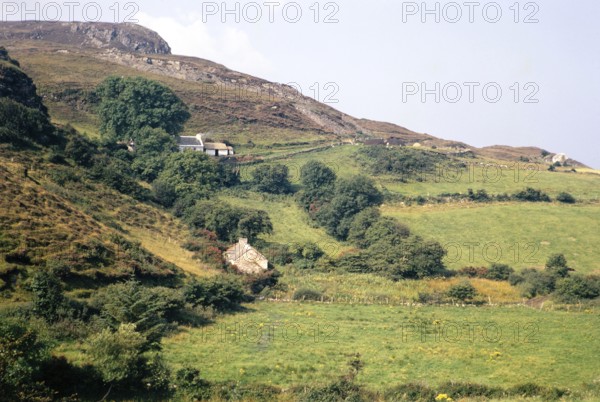 Traditional crofting farming landscape, croft farmhouses in small fields on hillside, County