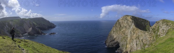View of blue sea and cliffs with rock gate from Portacloy Loop Cliff Walk, Muingnabo, County Mayo,
