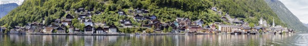 A, Hallstatt, Pano, k, panoramic view of a village on the shore of a lake, nestled in green hills,
