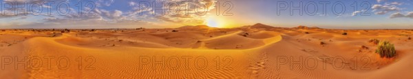Sunset over a vast desert landscape with sand dunes, Sahara, Morocco