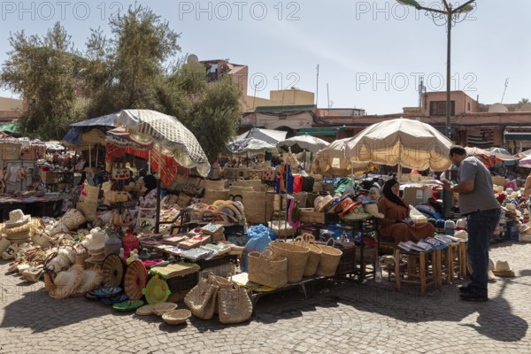 A lively marketplace with stalls full of baskets and crafts