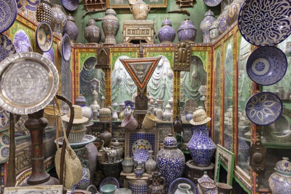 A bustling traditional market full of colorful ceramic ware and handmade pottery showcasing a rich
