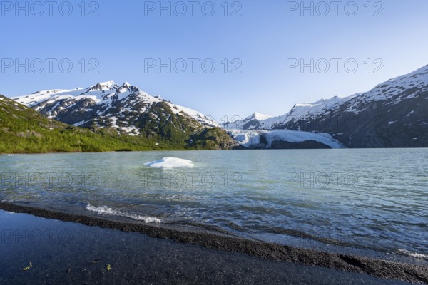 Snowy mountains and glaciers Portage Glacier on Portage Lake glacial lake, Chugach National Forest,