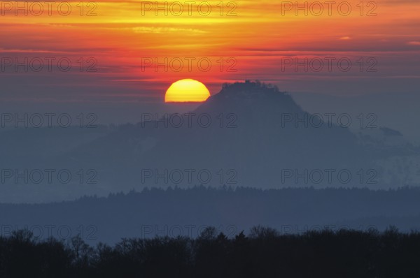 The distinctive silhouette of the Hohentwiel Hegau volcano at sunset, Konstanz district,