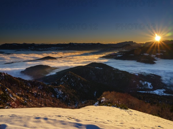 Alpine panorama at sunrise in winter, in the fog valley, Untersberg, Marktschellenberg,