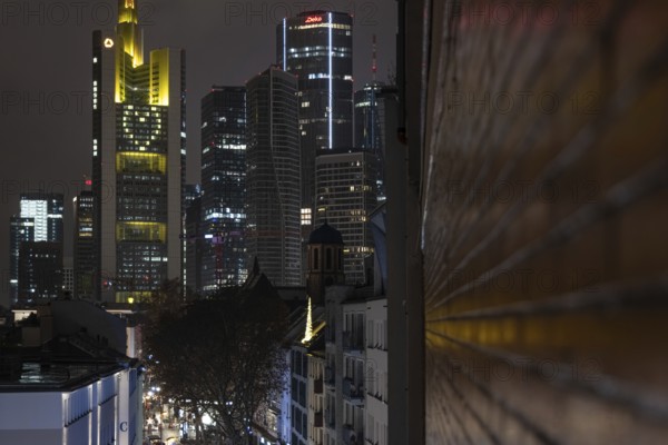 A yellow heart glows on the façade of the Commerzbank Tower in Frankfurt am Main at Christmas time