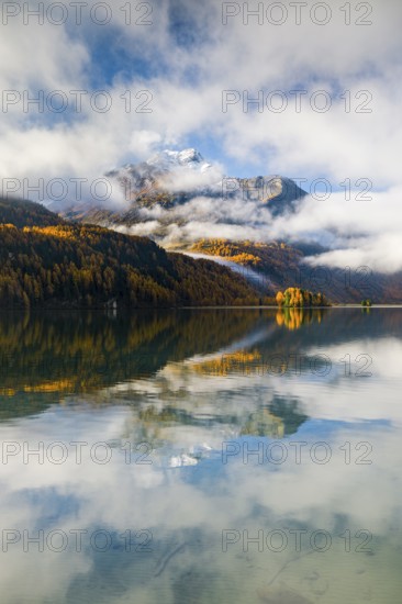 Clouds of fog over Lake Sils with Piz da la Margna in the background, Upper Engadin, Canton of
