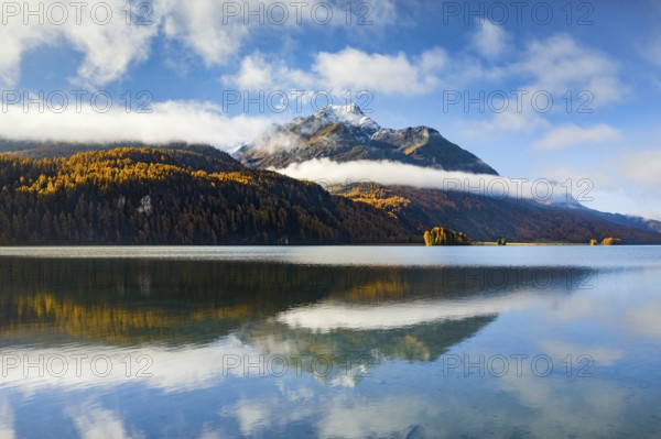 Clouds of fog over Lake Sils with Piz da la Margna in the background, Upper Engadin, Canton of