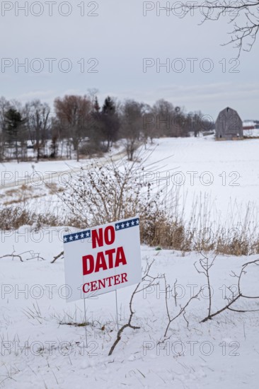 Saline, Michigan USA - 1 December 2025 - A sign on a rural Michigan road opposes a planned $7