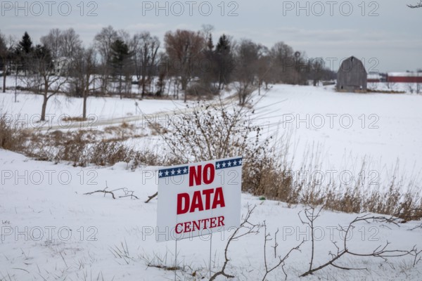 Saline, Michigan USA - 1 December 2025 - A sign on a rural Michigan road opposes a planned $7