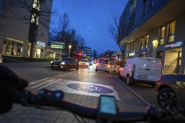 Cycling in the city, in the dark, in the evening, inner-city road, bicycle road, two-wheeler