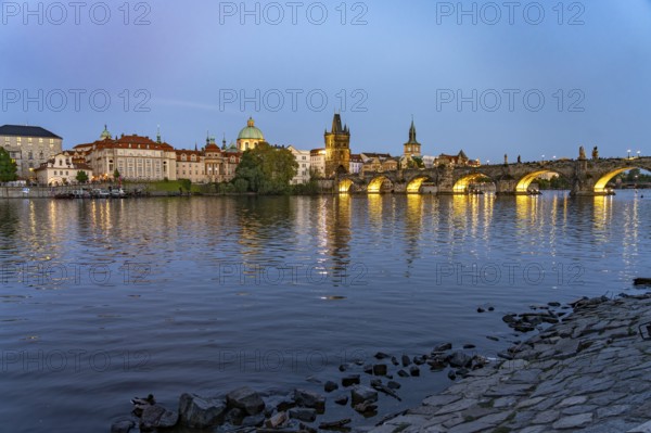 Old Town of Prague with Vltava River, Charles Bridge and Old Town Bridge Tower at dusk, Prague,