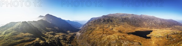 Autumn colours of Pen-y-Pass over Miner's Track, Start Point and road A4086 from a drone,