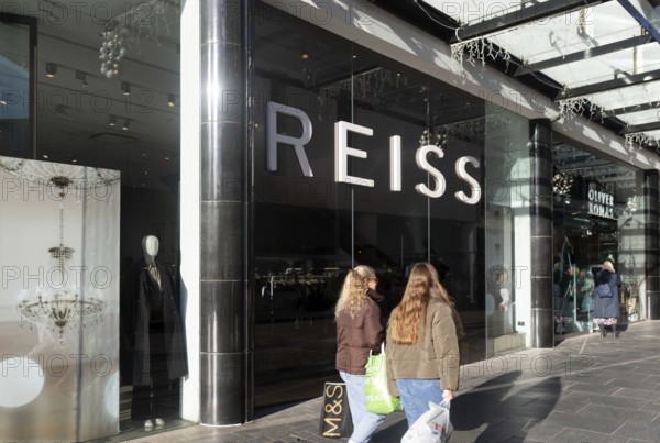 Shoppers walking past Reiss shop store in city centre, Princesshay, Exeter, Devon, England, UK
