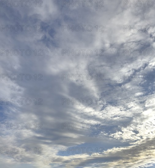 Cloud cover just in front of dusk with linear Altostratus clouds above it Cumulus mediocris with
