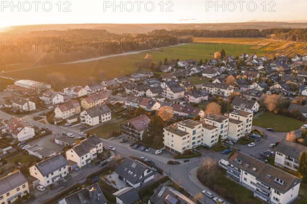 Aerial village with settlements and fields in evening autumn light, Althengstett, Calw district,