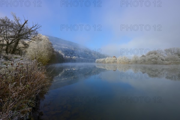 Wintery river with foggy atmosphere and peaceful landscape, hoarfrost, winter, Boxtal,