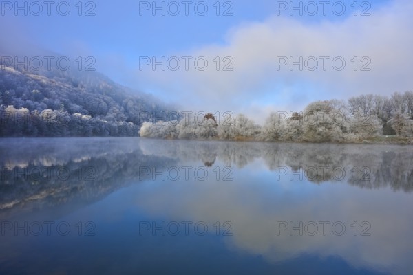 Clear water of a wintry river with fog and reflections of trees, hoarfrost, winter, Boxtal,