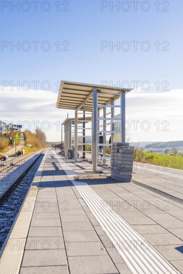 Spacious railway platform with modern architecture and far-reaching views, new Hermann Hessebahn