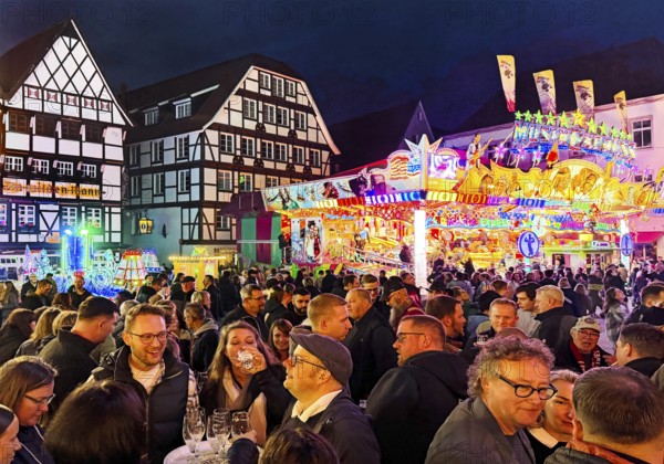 Many people at the All Saints Fair in the evening in front of half-timbered houses, Old Town,